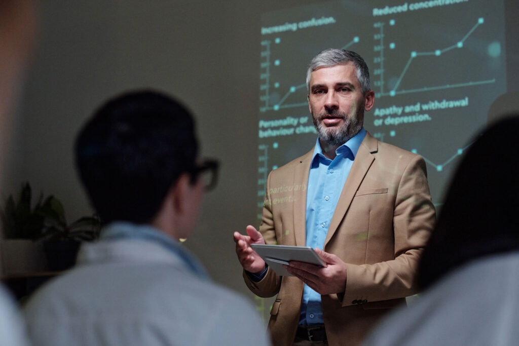 businessman-speaking-to-audience-at-conference-hol-2025-03-15-23-43-07-utc